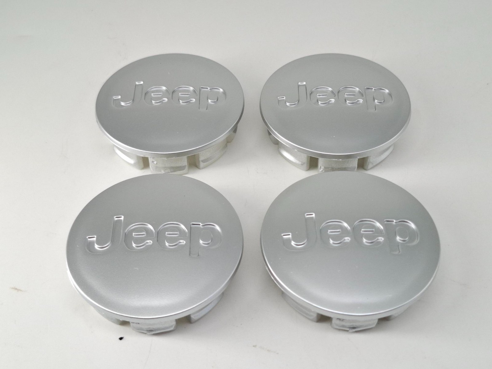 4 TAPPI COPRIMOZZO PER Jeep 55mm esterno BORCHIE CERCHI IN LEGA