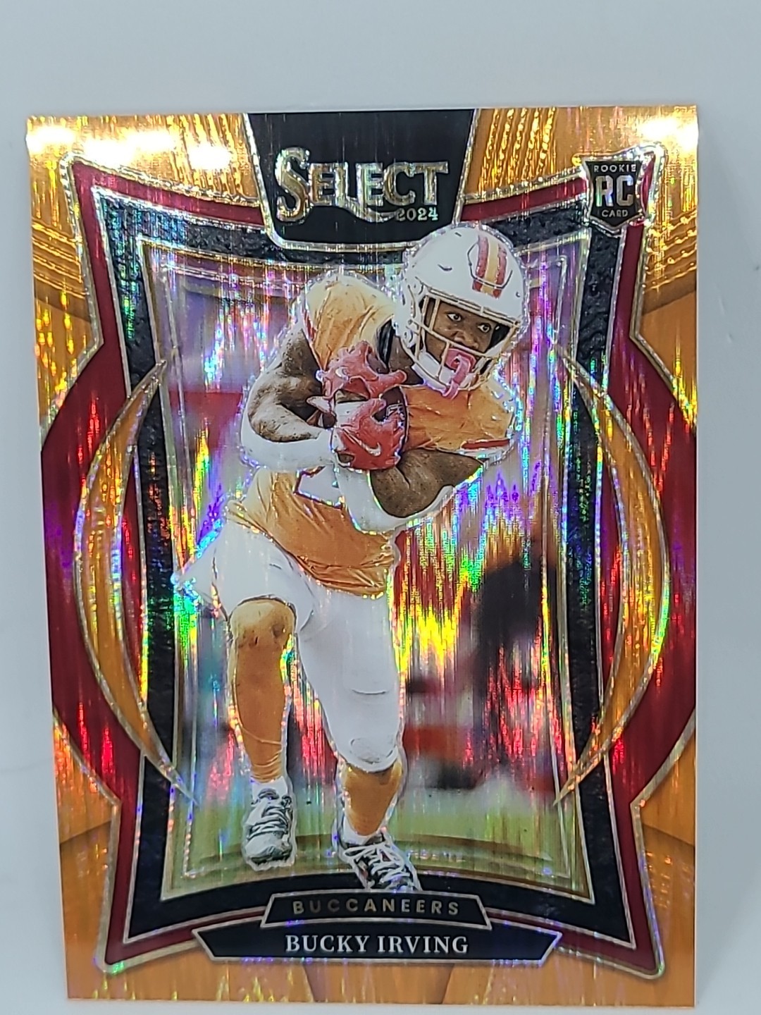 2024 Panini Select - Concourse Bucky Irving #4 Orange Shock Prizm /499 (RC)