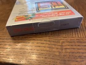Atari 7800 Dig Dug - Partially Sealed , Torn At Bottom. NIB