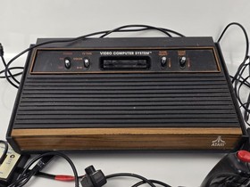 Atari 2600 CX-2600A Woodgrain 4-Switch Console Lot w/ 4 Joysticks 2 Paddles