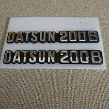 Datsun 200B Chrome Emblem Set of 2 Excellent