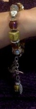 Vintage beaded glass silvertone bracelet bird feather charm