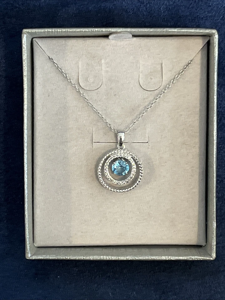 Colgante Zales de plata de ley con doble círculo de zafiro blanco y topacio azul Foto 2 de 4
