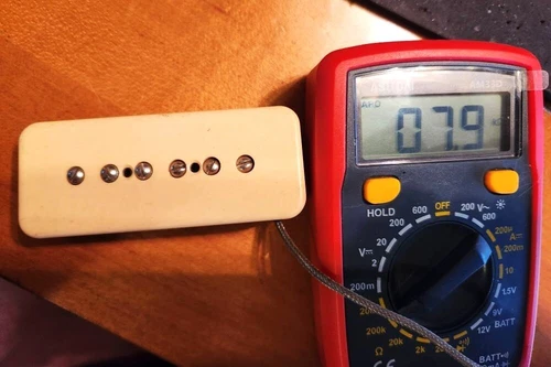Used vintage Gibson P-90 pickup. Creme cover. Works perfectly. 7.9 ohms.