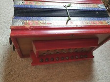 Very old 1 row diatonic button accordion w. couplers at the side need service
