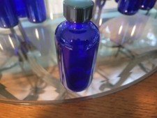 10 4 oz blue cobalt bottles with lids