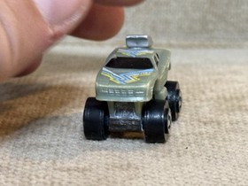 Micro Machines 1987 Quadchamps Green lifted car