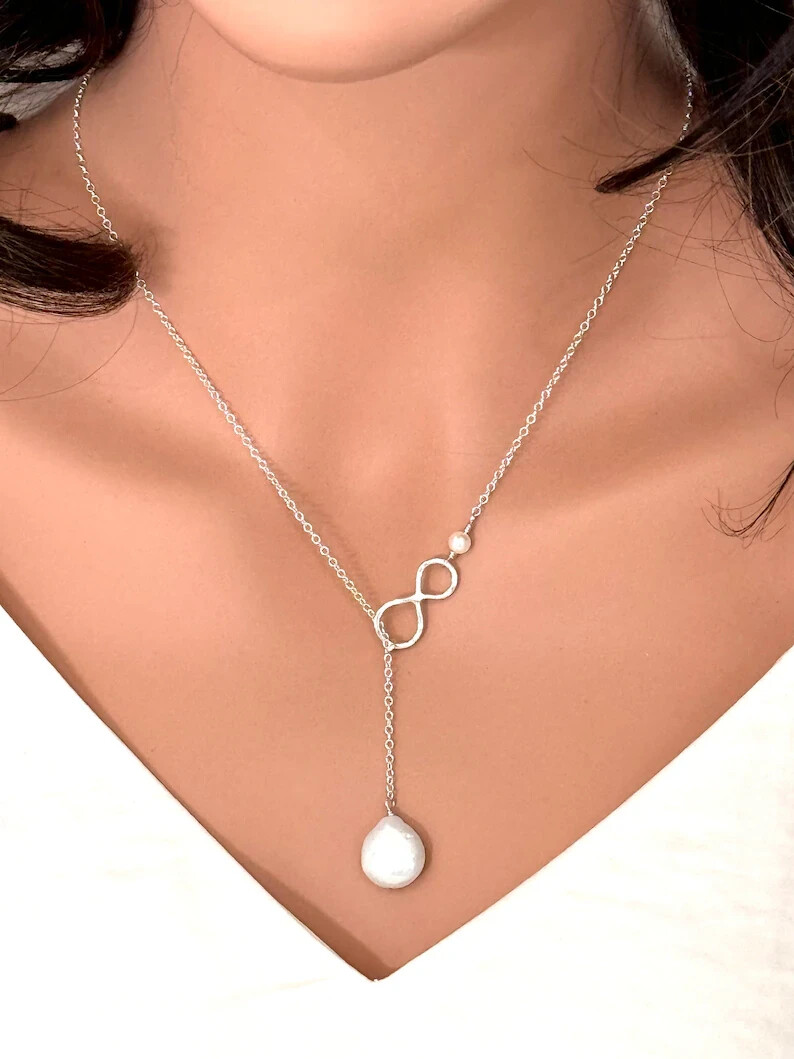 935 Silver With Fancy Round Pearl With Gorgeous Infinity Shape Y