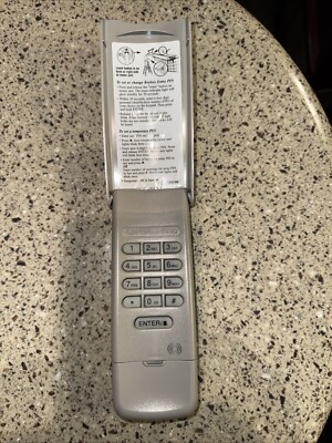 LiftMaster LM 377 Security + 315MHZ Wireless Key Pad. Purple Learn Button Only.