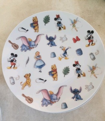 eight total Disney ZRike Brands Disney 100th anniversary 8in dessert Plates