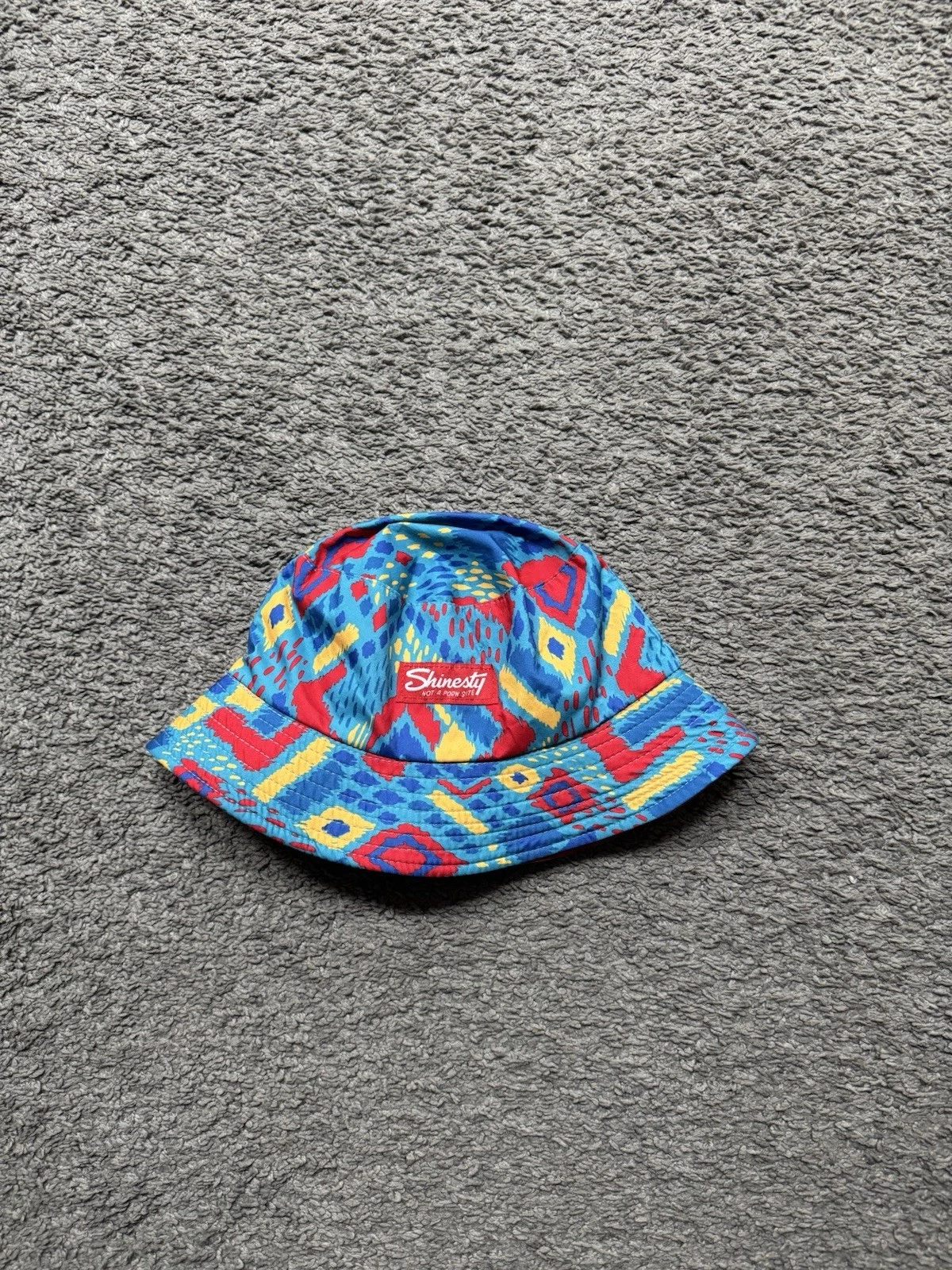 Shinesty The Chill Out Reversible Bucket Hat Stay Weird Multicolor Red Blue