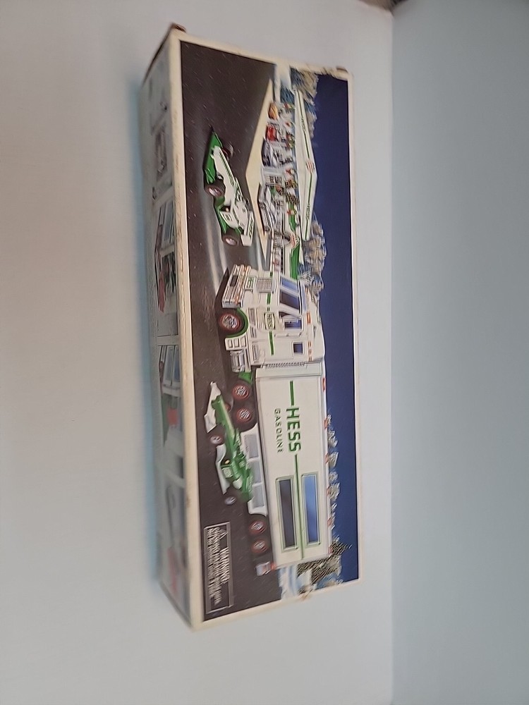 2003 Hess Toy Truck and 2 Race Cars . Batteries Not Included.