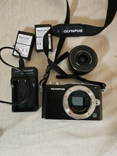 Olympus PEN Mini E-PM1with a Panasonic Lumix G Vario 12-32mm and olympus lens