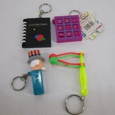 Lot of 4 Basic Fun Novelty Keychains Pez Colorforms Tic Tac Toe and Knockers