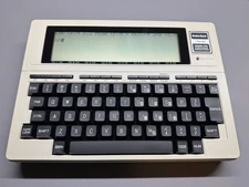 MINT TRS-80 Tandy Model 100 with new backup battery, REX and CPM