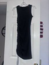 Black draped bodycon dress with a ribbed texture with adjustable side drawstring