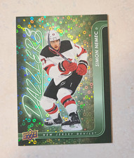#DZ-32  2024-25 Upper Deck Series 1 Simon Nemec Dazzlers Blue NJ Devils