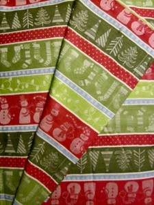 FUN HOLIDAY TABLECLOTH, 62"X 84" RECT. SNOWMEN,TREES, STOCKINGS, SNOWFLAKES