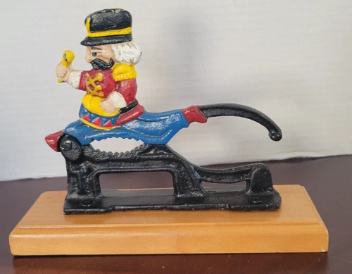 Vintage Cast Iron  Nutcracker painted on mounted wood base - Decorative