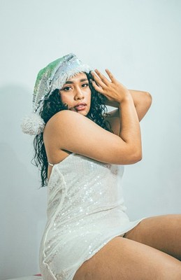 A_festive_indoor_portrait_featuring_a_woman_i_1764843492188_8_11x17
