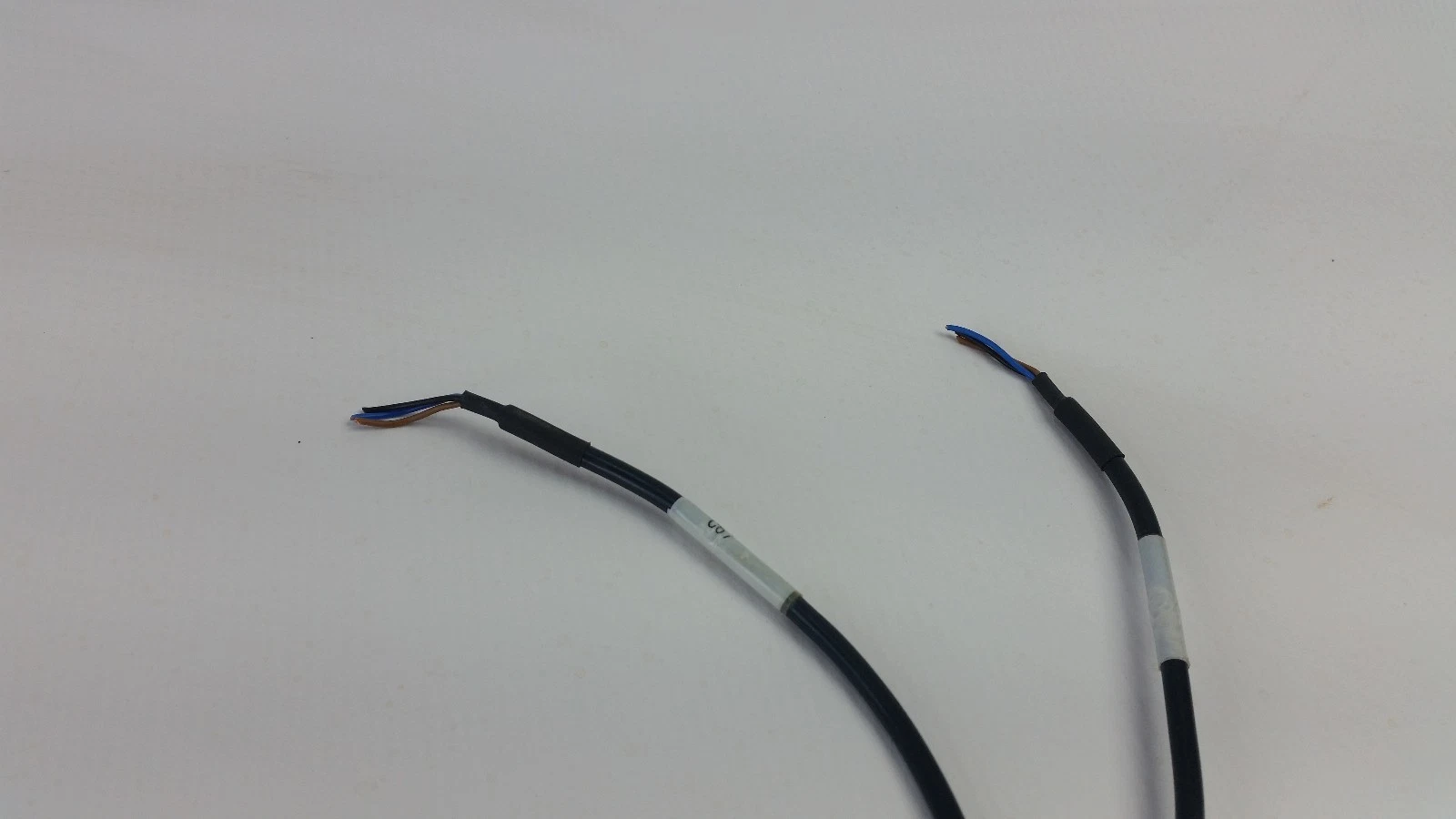 Stripped ends of the E3X-DA11-N power and output cables