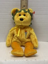 Ty ( Victory) 2004 Gold Beanie Baby Bear Olympic Torch On Chest Green Leaf Halo