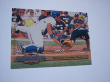1993 Upper Deck baseball Mike Piazza (HOF) Rookie of the year card #310 NM-MT. rookie card picture