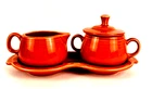 Fiestaware Covered Sugar Bowl and A Creamer With Tray Persimmon Homer Laughlin