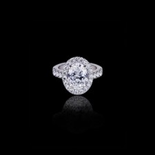 2ct Oval Cut Simulated Diamond Accent Solitaire Halo Ring 18k White Gold Plated