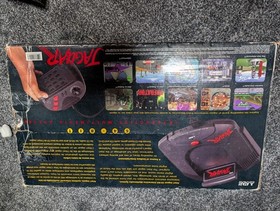 Atari Jaguar Console boxed with 2 controllers and 2 games manuals for everything