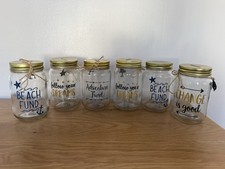 6 Glass Money Jars Each With Slogans