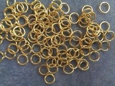 Split ring, gold-finished steel, 8mm round. Sold per pkg of 100.