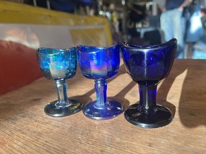 Set Of Three Eyewash Glasses, Two Iridescent, One Cobalt Blue