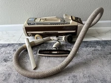 Electrolux 1401-B canister vaccum with pictured attachments. No bags