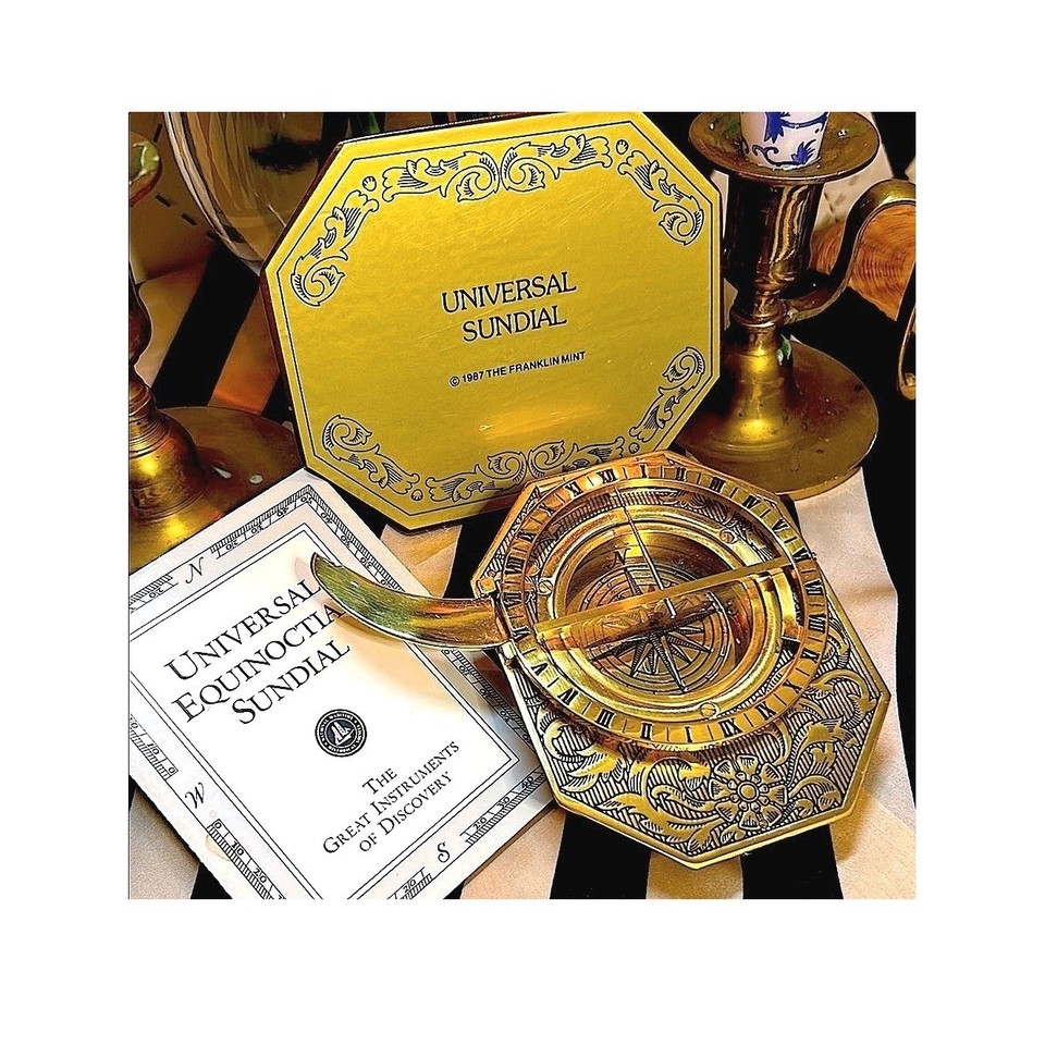 A Franklin Mint brass equinoctial sundial-compass combo — a working scientific instrument and a seriously classy desk object at the same time.