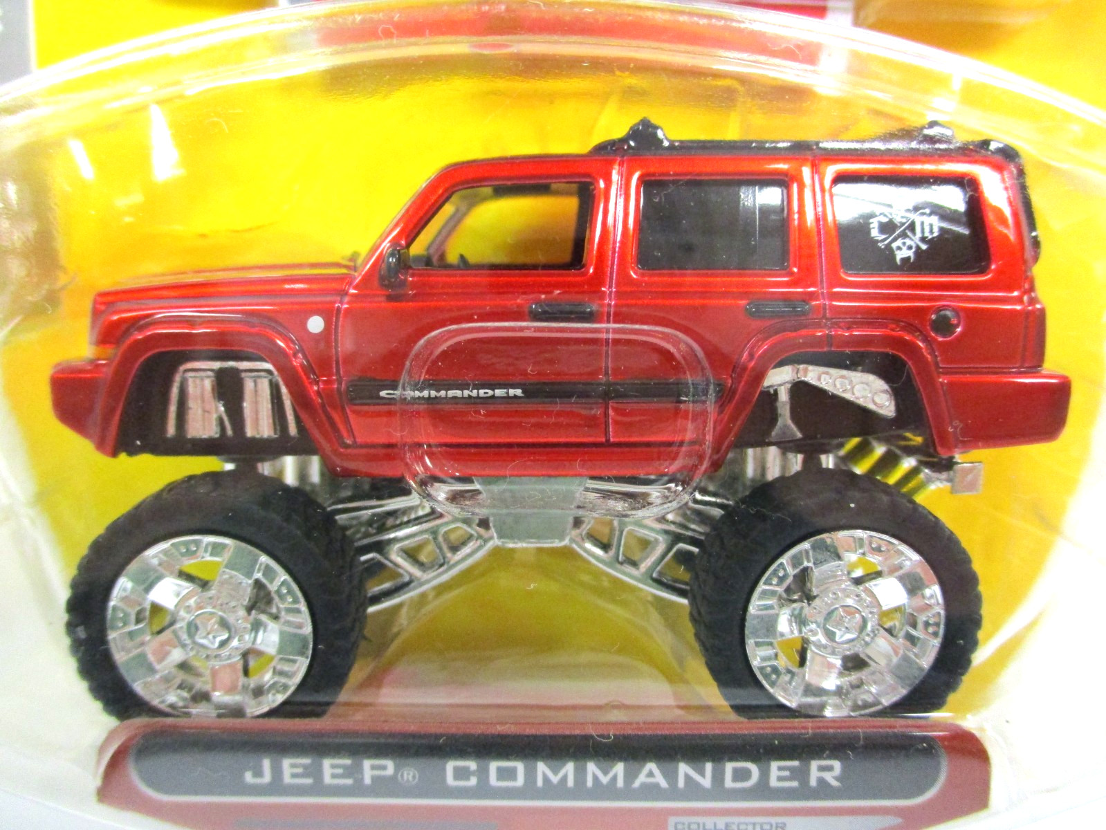 JADA - HIGH PROFILE - LIFTED JEEP COMMANDER 4X4 - 1/64 DIECAST