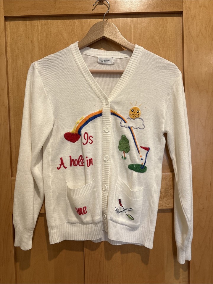 A genuine vintage novelty golf cardigan — the kind of quirky, character-rich knitwear that fashion-forward thrifters hunt for.