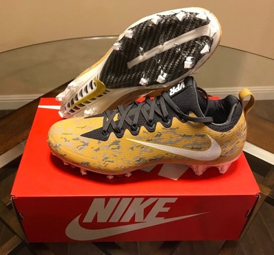 white and gold nike football cleats