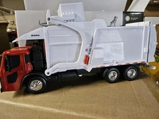 1/25 scale Mack LR with McNeilus Red Cab Meridian™ Front Load Refuse Truck & Bin