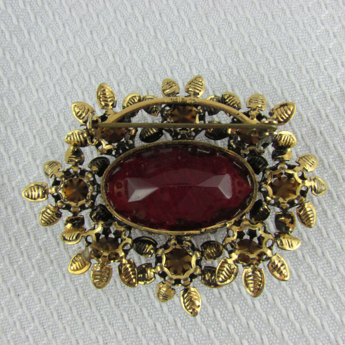 Red jewel sales brooch