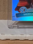 2025 Panini Donruss Downtown #17 Shedeur Sanders regular size case hit with clear plastic window and red logo banner.