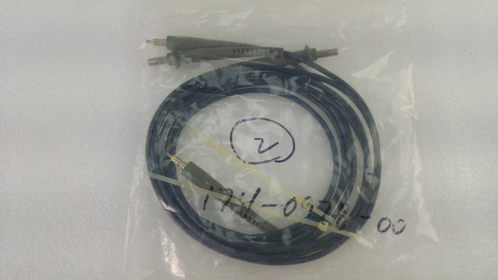 Tektronix probe cable in a bag marked 174-0978-00, with the probe connector end visible