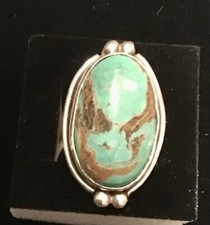 A vintage sterling silver Navajo made turquoise ring. It measures a Size 6.