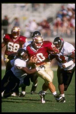 Quarterback Dan Kendra Florida State Seminoles tries to evade - 1997 Old Photo