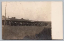 Postcard Men Lined Up Laborers Work Camp ? c1910 RPPC Unposted
