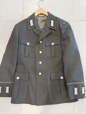An authentic vintage East German (NVA/DDR) stone-gray military service tunic.