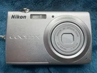Nikon COOLPIX S203 3x Zoom Digital Camera - Silver Working Battery & charger