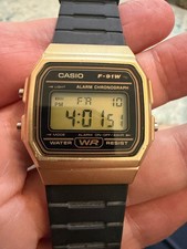 Casio F-91W Gold Tone Digital Alarm Chronograph Watch Black Resin Strap 593