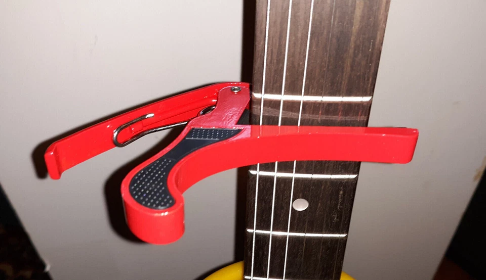 LOTE de 100 piezas Abrazadera de afinación Llave Gatillo Guitarra Eléctrica Acústica Capo, Liquidación Foto 2 de 2