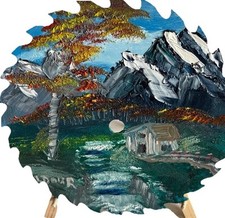 Hand painted oil 9-1/2  saw blade- Mts W/Cabin  waterfalls. Signed Stand Incl